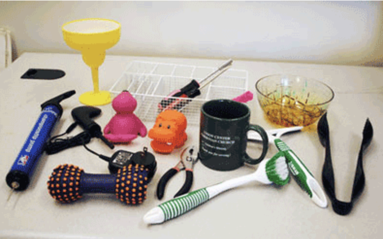 A diverse collection of household objects with different shapes, materials, and grasp points
